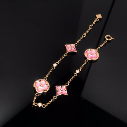 [Kincade Jewelrys] BRACELET EN OR ROSE AVEC 4 MOTIFS ÉTOILE ET SOLEIL 