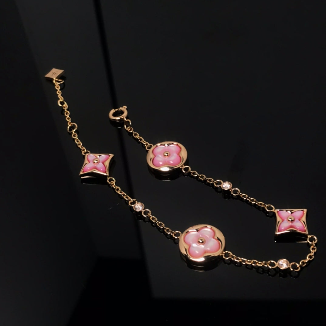 [Kincade Jewelrys] BRACELET EN OR ROSE AVEC 4 MOTIFS ÉTOILE ET SOLEIL 