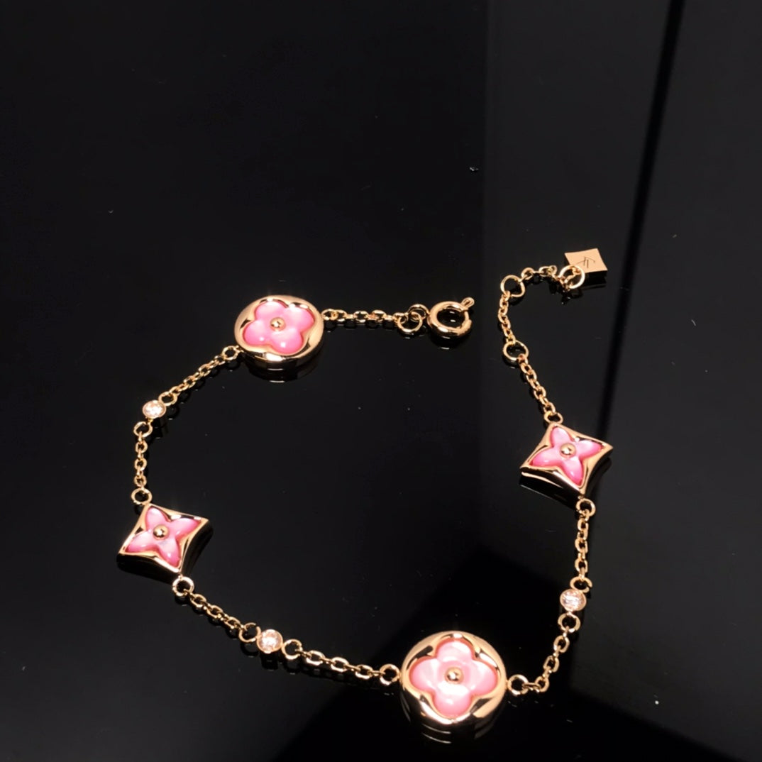 [Kincade Jewelrys] BRACELET EN OR ROSE AVEC 4 MOTIFS ÉTOILE ET SOLEIL 